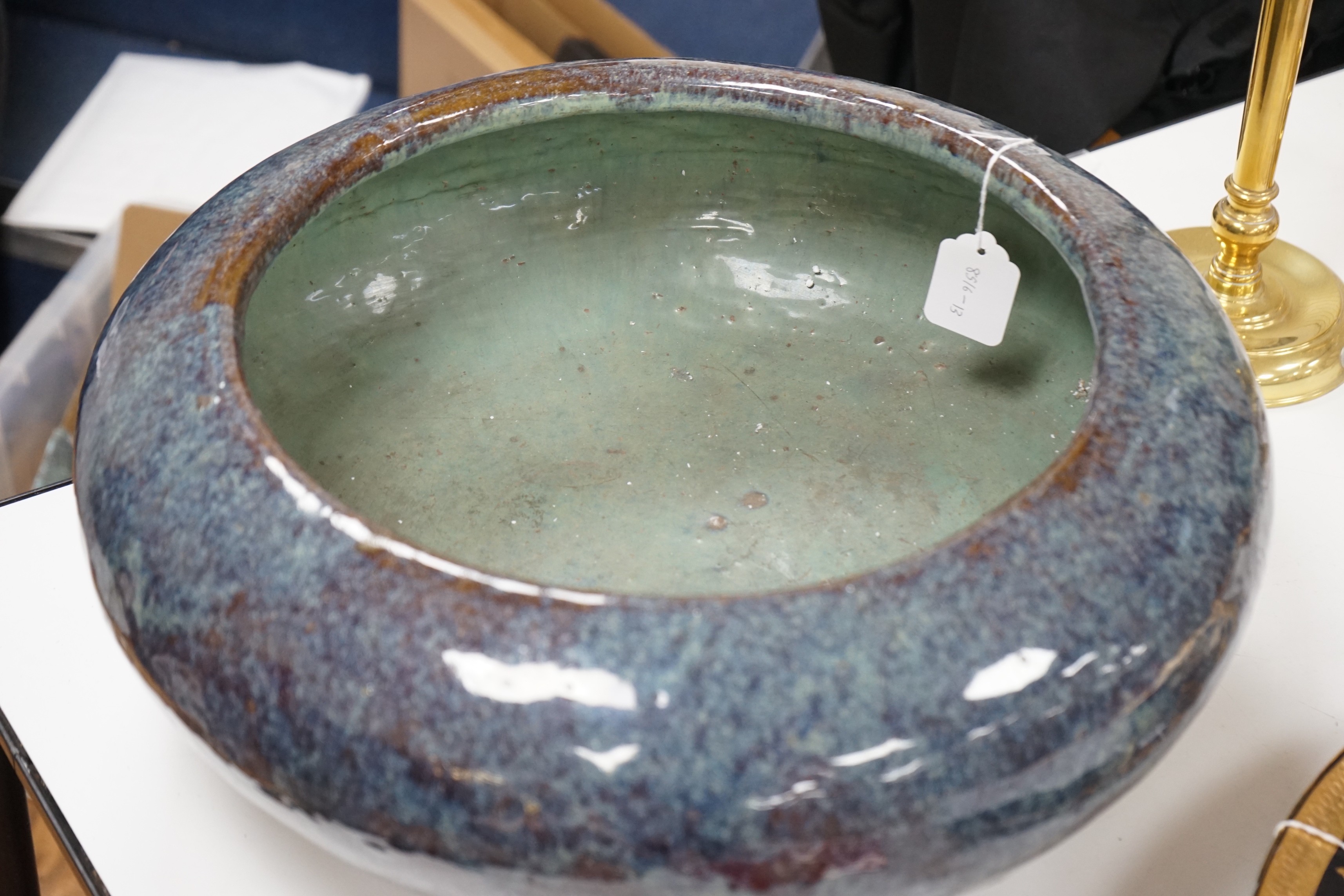 A large Chinese Shiwan stoneware tripod vessel or censer, late 19/early 20th century, 47cm diameter
